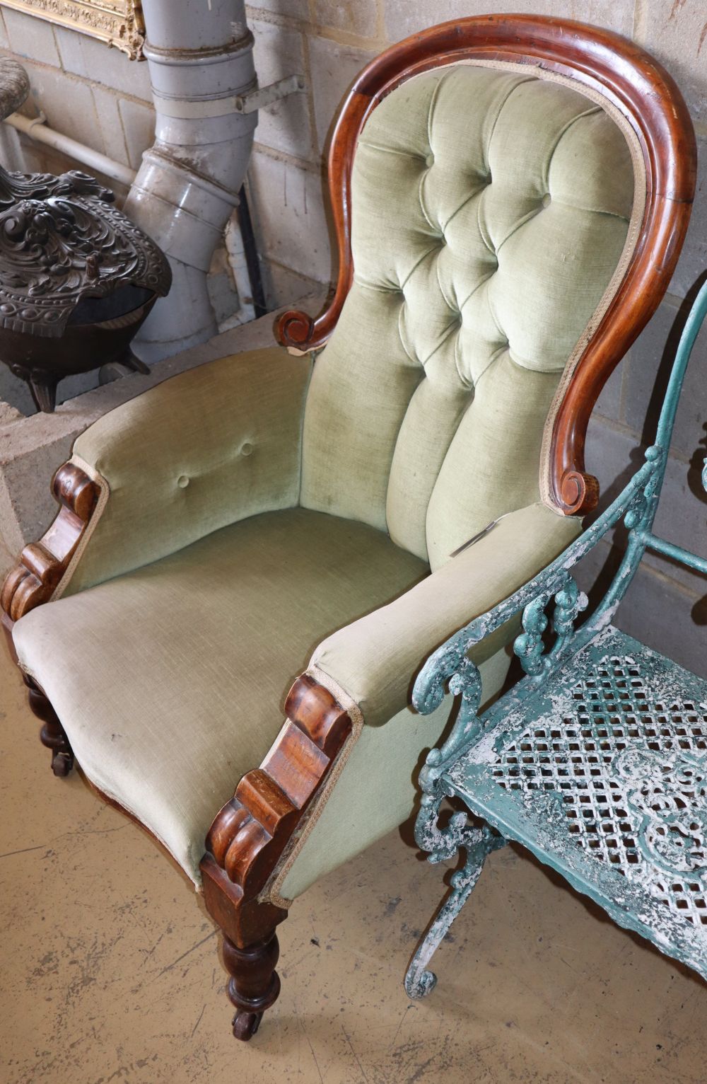 A Victorian mahogany spoonback armchair